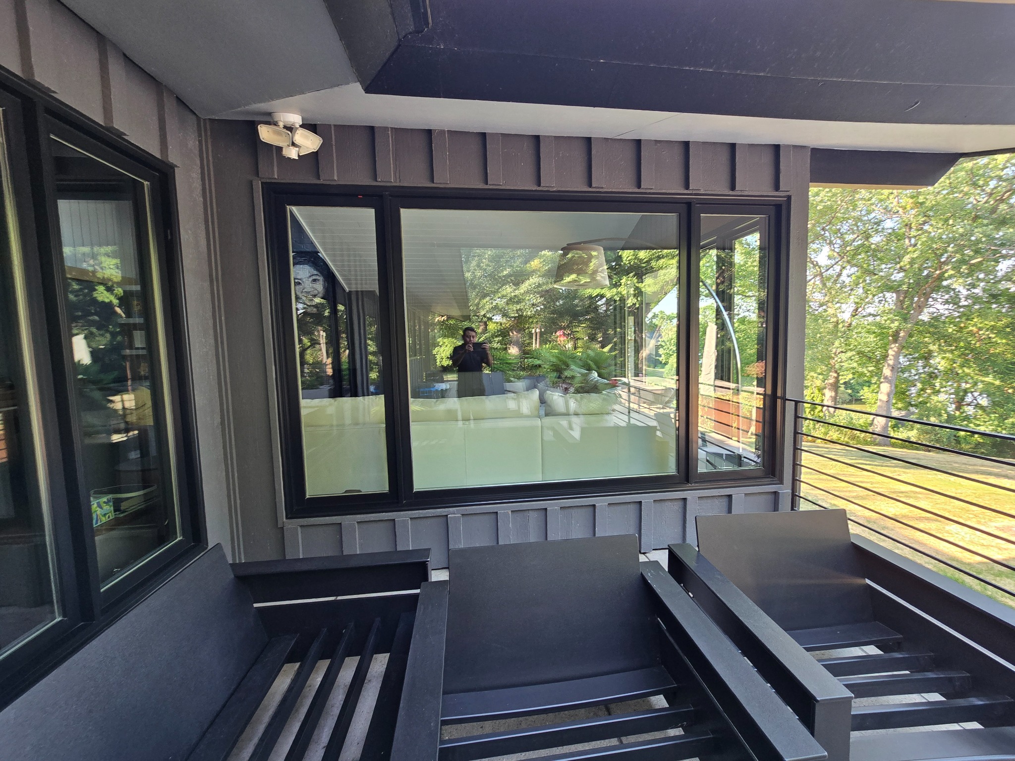 Clean black-framed residential windows after service