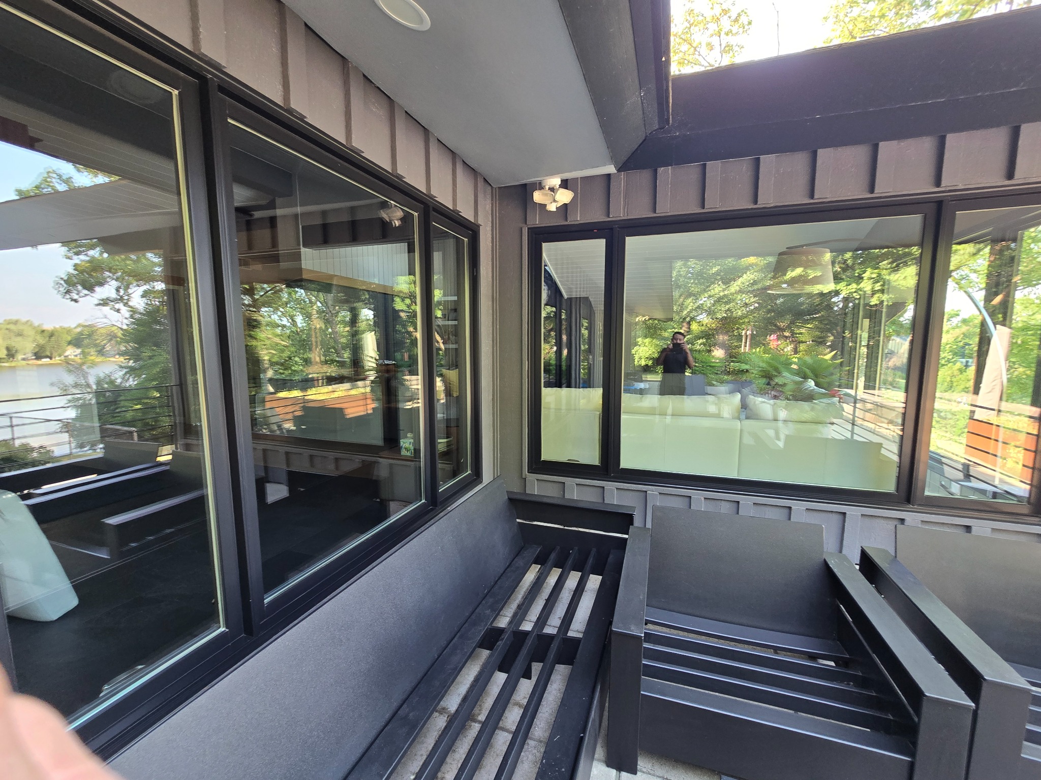 Second-story window cleaning access with ladder